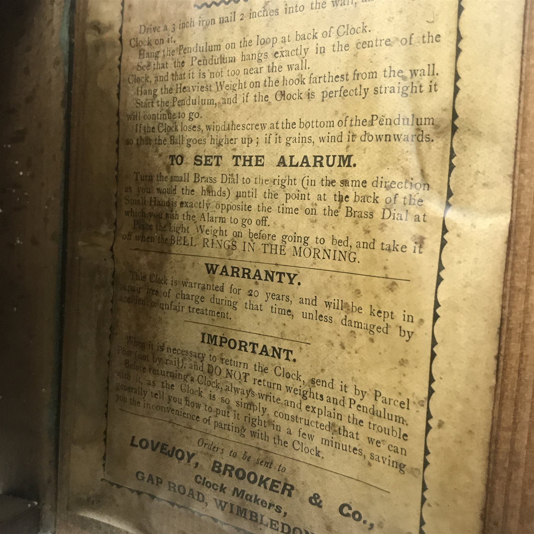 Early 20th century Postman’s alarm clock, circular beech frame dial, D28cm (no weight or pendulum)