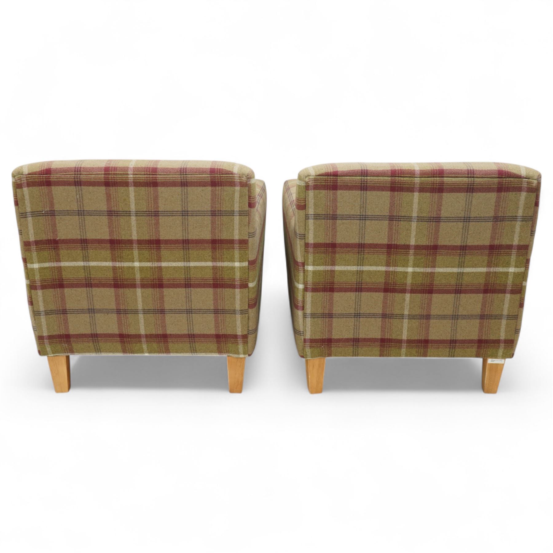Contemporary pair of upholstered armchairs, in red and green chequered fabric with loose seat and back cushions, box arms and light stained square legs