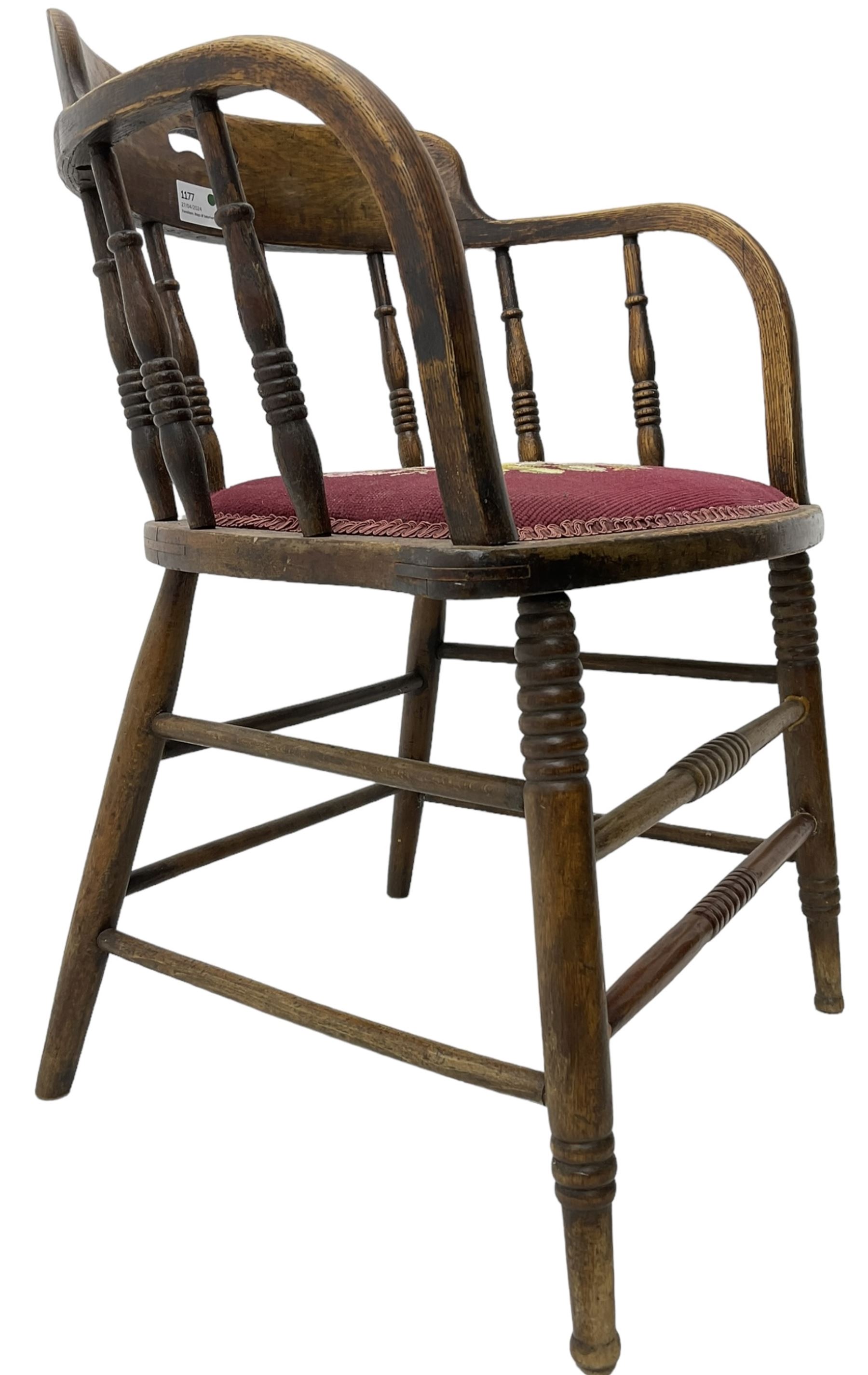 Early 20th century American oak smokers bow tub armchair, shaped cresting rail with pierced handle over ring turned spindle back, seat upholstered in pink tapestry fabric (W56cm, H73cm); small 20th century walnut occasional table on turned supports (W43cm, H70cm, D33cm)