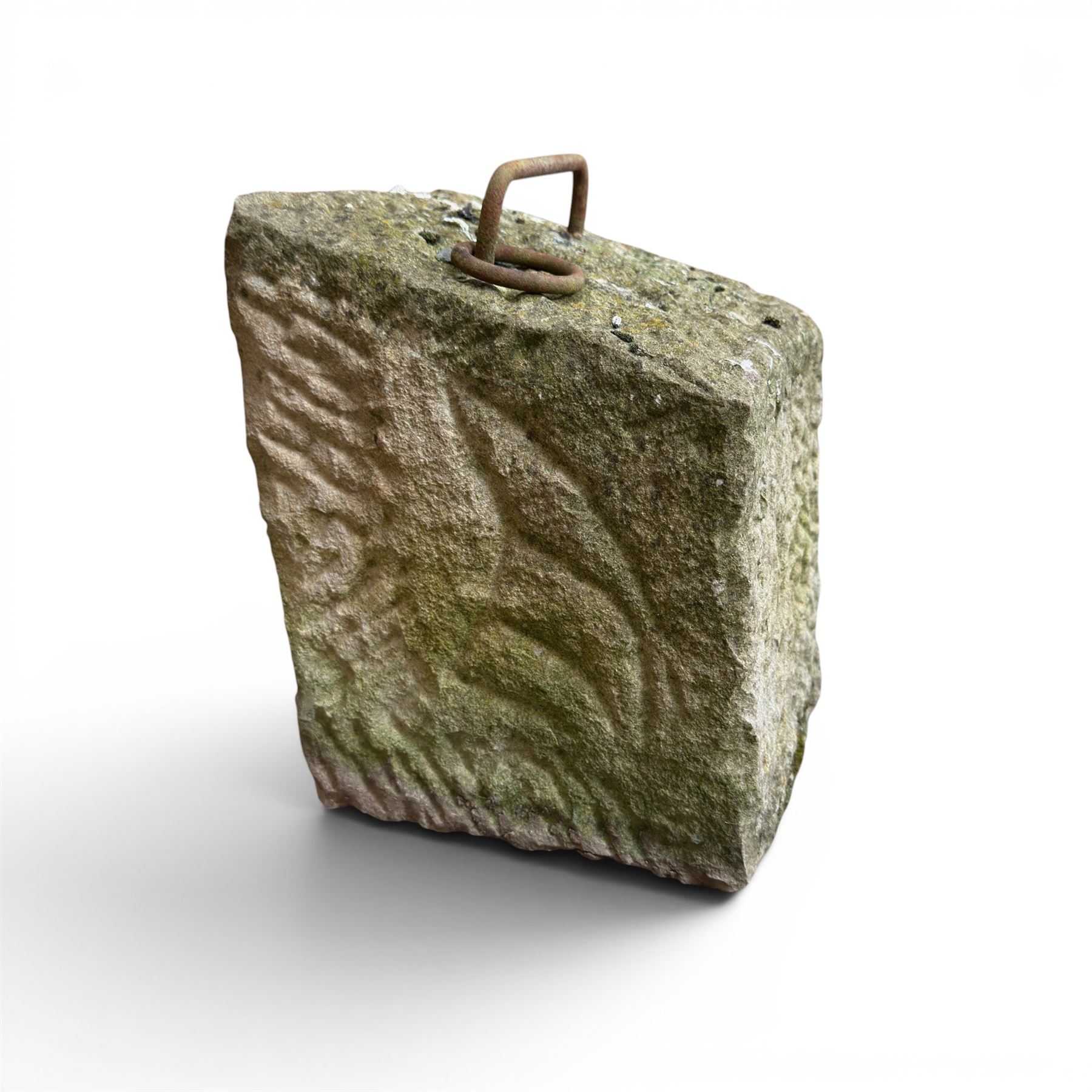 19th century carved tethering stone, square sloping form with iron work loop