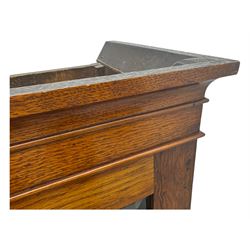 Late 19th century oak display cabinet, rectangular form with a pair of glazed doors enclosing shelves, raised on cabriole supports with carved detailing ending in claw feet