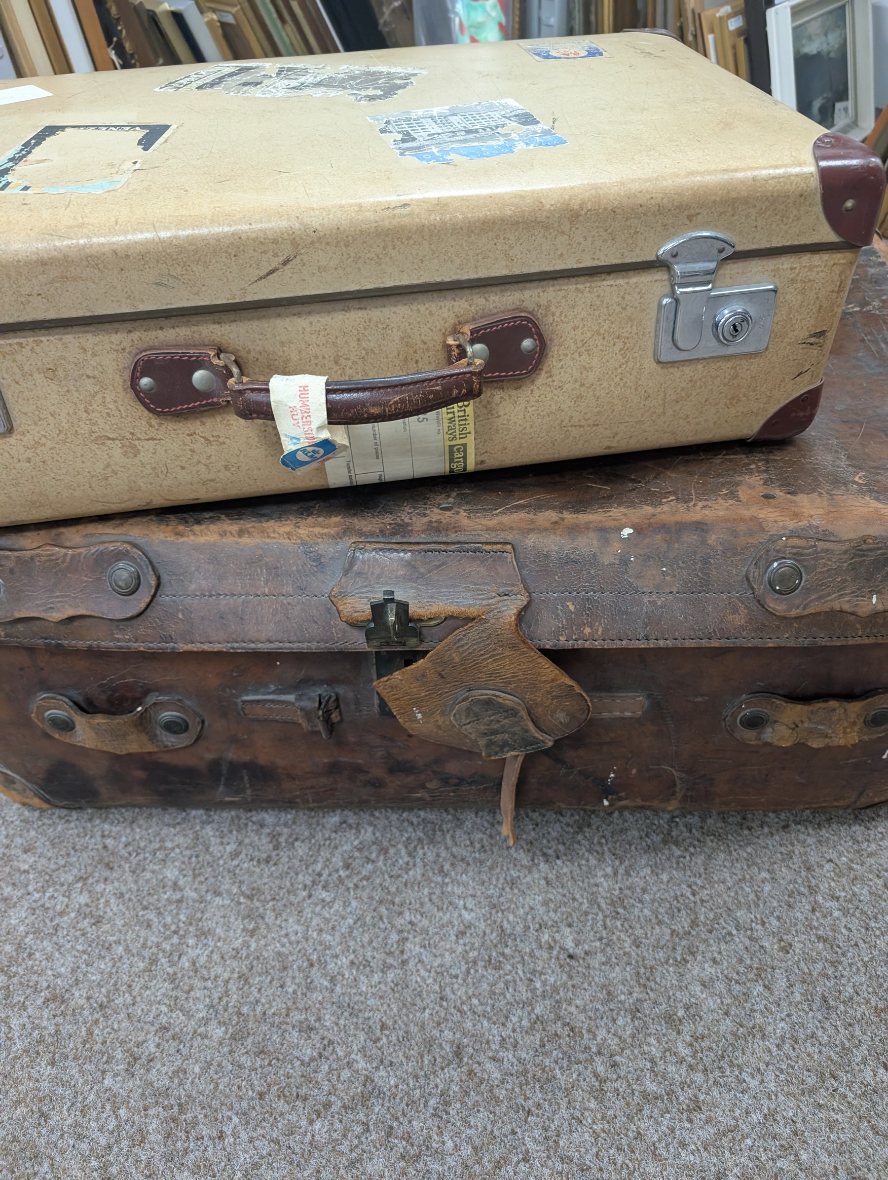 Large leather travelling trunk, together with a vintage suitcase