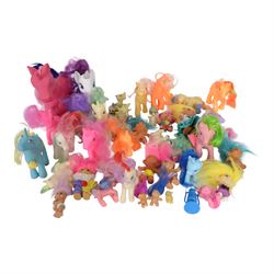 Collection of toys, including My Little Ponies, Troll Dolls, Pocket Dragons and similar