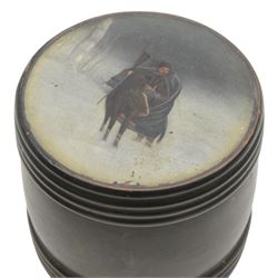 19th Century Russian lacquered tobacco box the painted panel top depicting a man on horseback in the snow, together with two horn pin cushions upon wooden plinths 