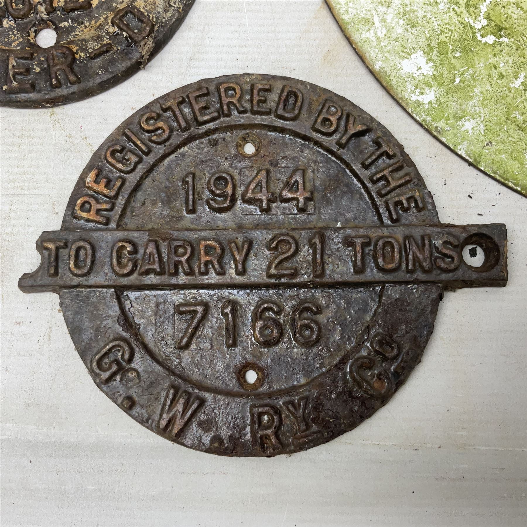 Victorian cast iron railway wagon plate, 'To Carry 10 Tons 4012, Registered by LNER-D 1898', together with a similar mid 20th century example, a smaller cast iron LMS wagon plate, Chalwyn signalling lamp, Give Way to Trains enamel sign and an enamel signal sign