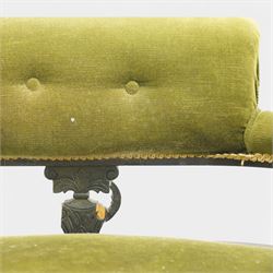 Late 19th century upholstered settee, shaped padded back with a row of button detailing, downswept open arms with upholstered pads, upholstered in olive green velvet, the frame with moulded rails and raised on turned front supports and out-swept rear legs with castors