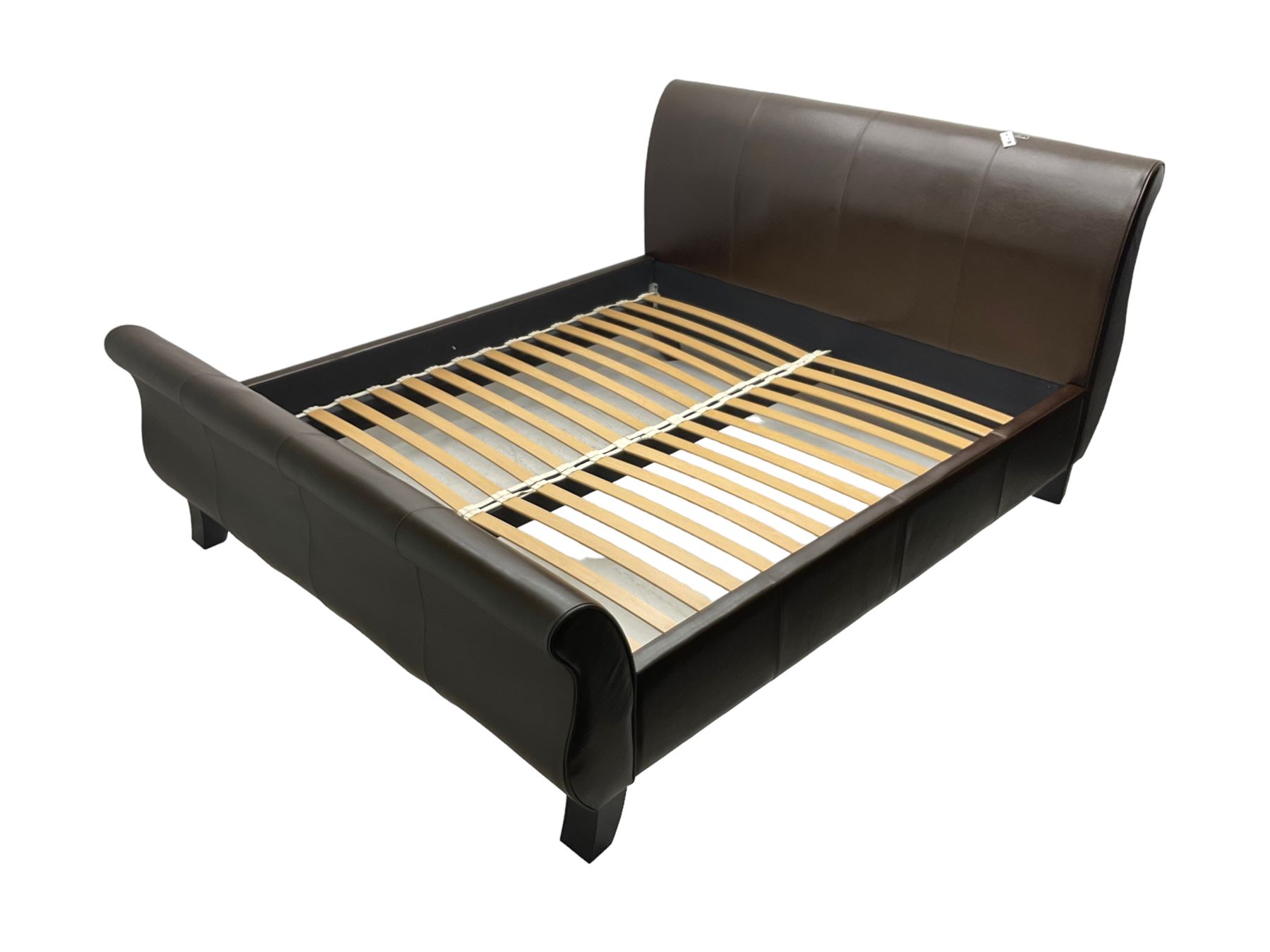 Super king 6' sleigh bed, upholstered in chocolate brown leather, with ebonised splayed feet