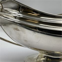 1920s silver twin-handled pedestal bowl, of navette form with twin bifurcated acanthus capped scroll handles, engraved with initial R to body and upon spreading oval foot, hallmarked Hawksworth, Eyre & Co Ltd, Sheffield 1925, including handles H21.8cm