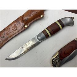 Norwegian Brusletto Geilo hunting knife with 10cm single edged blade, alloy and leather grip; in decorative leather sheath L23cm overall; modern ornate folding knife in box; and 19th century steel rabbit gin trap, having 10cm rectangular serrated jaws and iron stake on chain (3)