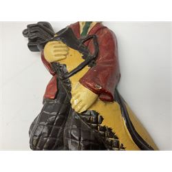 Pair of cast iron Dulux Old English sheepdog doorstops together with another modelled as a golfer