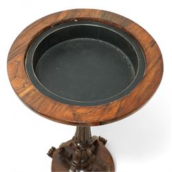 An early Victorian rosewood plant stand with removable marble top, with metal interior liner, circular top above fluted column with arched scroll supports on turned base with scroll feet 