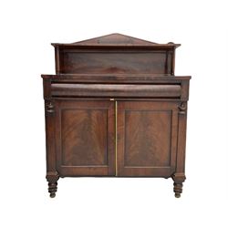 Early 19th century mahogany chiffonier side cabinet, the raised arched back with open shelf over cushion frieze drawer and two panelled cupboards, raised on turned supports