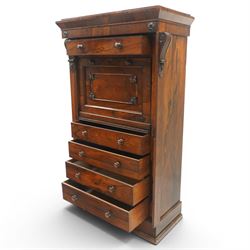 Victorian rosewood Wellington secretaire chest, the projecting stepped cornice over a banded frieze with moulded rosette mounts, single drawer over a secretaire fall-front opening to reveal a maple lined interior with assorted pigeonholes and correspondence drawers, over a lappet carved lower edge with four graduating drawers below, each with turned pull handles, flanked by hinged lock to the right and plain stile to the left surmounted by reeded corbels, raised on a skirted base