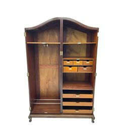 Early 20th century mahogany arched double wardrobe, two doors with crossbanding enclosing hanging rail and fitted interior with small drawers, shelves and sliding trays