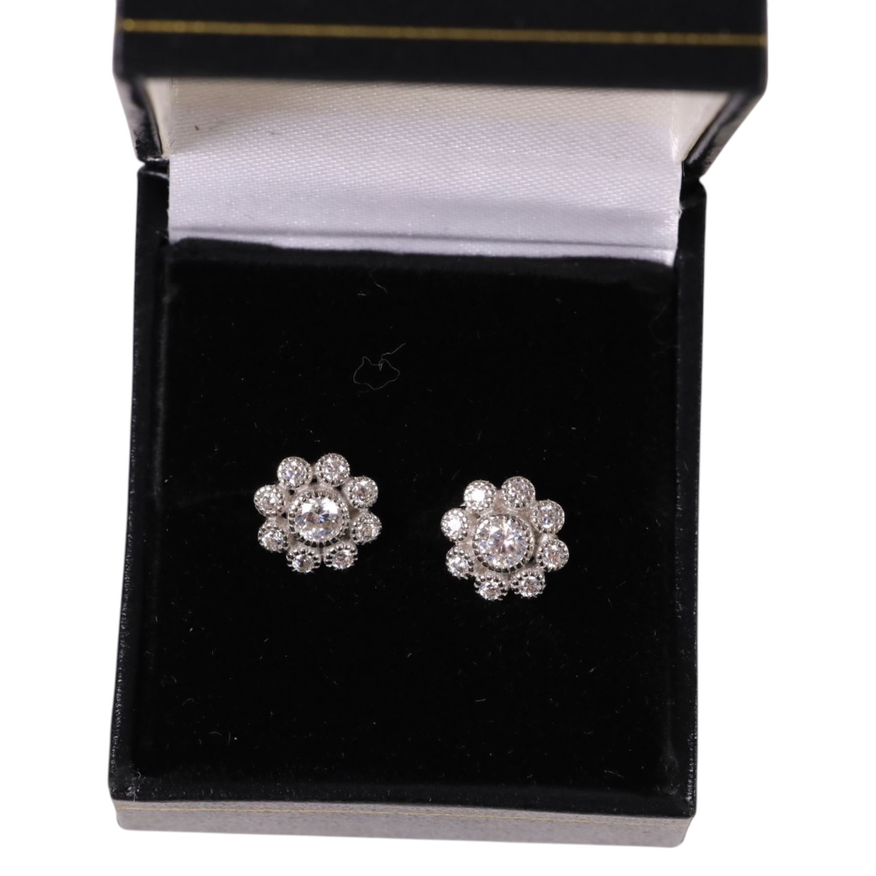 Pair of silver flower design stud earrings, boxed 