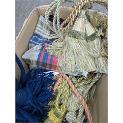 Collection of curtain fabric pieces and tassels