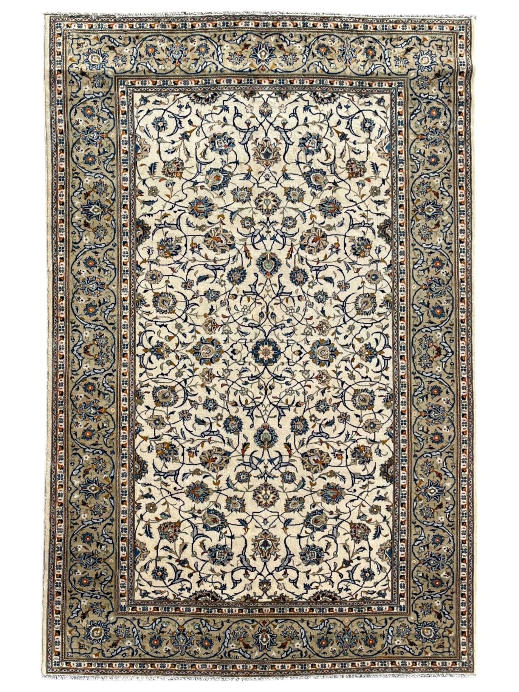 Persian Kashan ivory ground carpet, overall floral design, the field decorated with scrolling and interlaced leafy branches interspersed with palmettes, scrolling border decorated with stylised plant motifs, within floral pattern guard stripes 