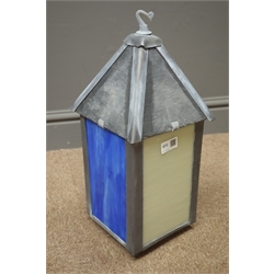  Lantern, with four stained coloured panes and slate top, battery controlled colour changes, W19cm, H43cm, D19cm  