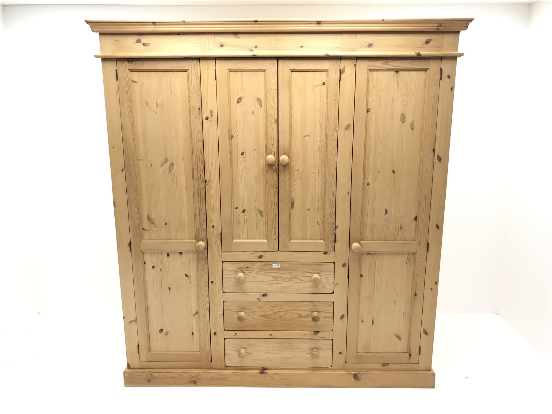 Solid pine combination wardrobe, two long doors flanking two short