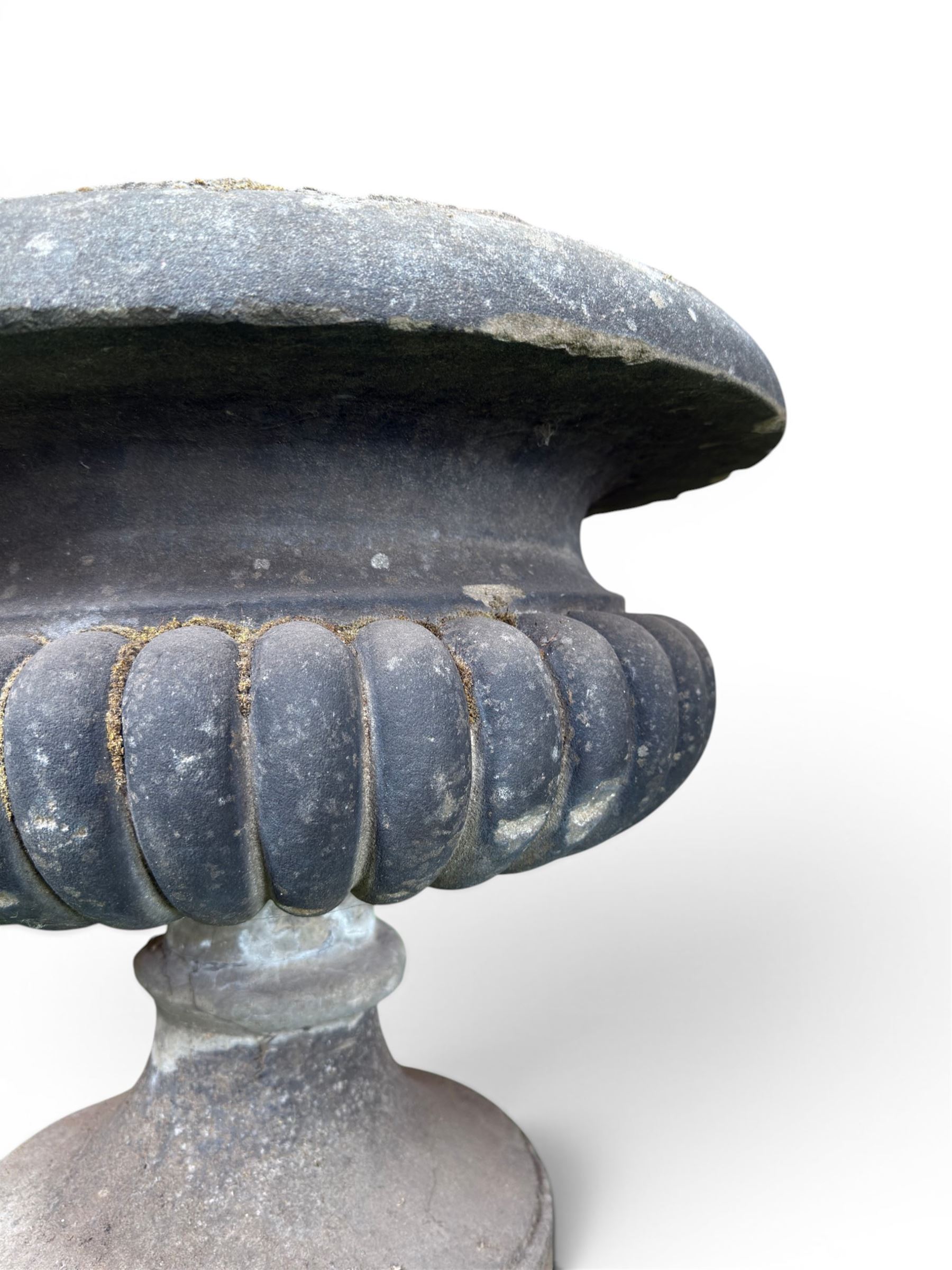 Carved sandstone garden urn, gadrooned campana form