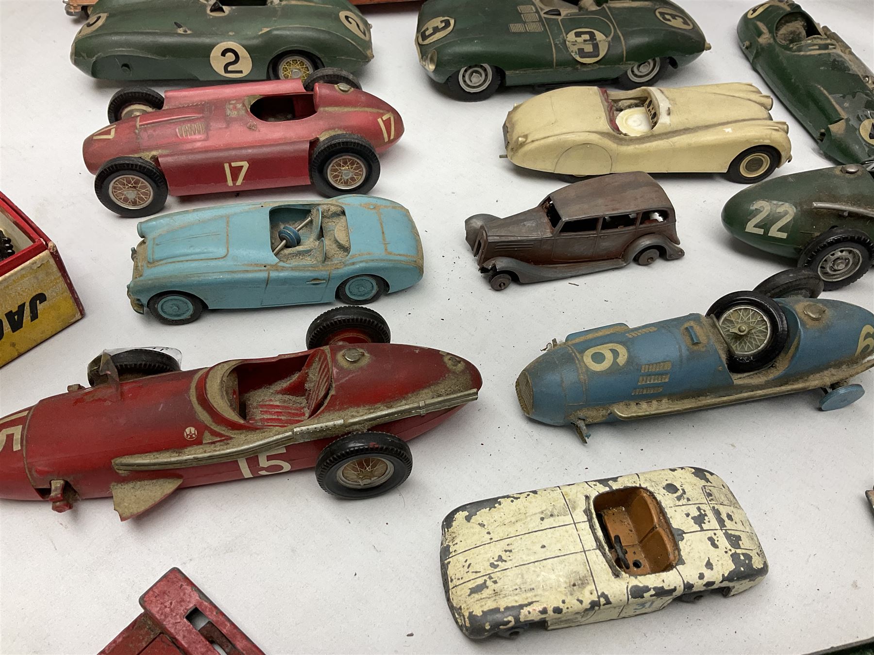 Various Makers - fourteen unboxed and playworn die-cast models including Wee-Kin Sunbeam Talbot, Corgi James Bond Aston Martin and ERF lorry, Dinky Thunderbolt Racing Car, Cadillac Eldorado, Cunningham C5-R, Lagonda etc; Minic tin-plate police car and jeep; other tin-plate models; Merit Plastic racing cars and quantity of spare parts etc