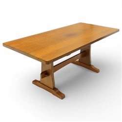 Beaverman - oak adzed top refectory table, the rectangular top raised on twin trestle supports with shaped feet united by a stretcher, the joints secured with exposed pegs, with carved beaver signature, by Colin Almack of Sutton near Thirsk