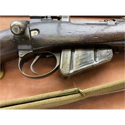 WW2 Lee Enfield No.4 Mk.1 .303 bolt-action rifle with hinged butt compartment, made by SA Ltd., Long Branch, Canada 1942, serial no.5L0646 L113cm; mounted on a framed display board with No.4 Mk.II spike bayonet, No.9 Mk.1 blade bayonet, two inert 5-round clips and brass biographical plaque by Antler Military Originals detailing DA Cert No.C3444 OLD STYLE DEACTIVATION SO FIREARMS CERTIFICATE REQUIRED OR RFD