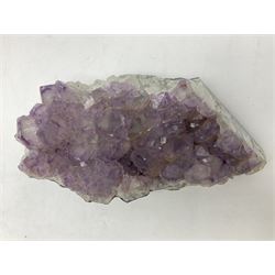 Amethyst crystal geode cluster, with well-defined crystals of various sizes, H10cm, L30cm