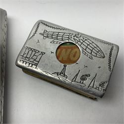 Aluminium cigarette case, by repute made from the R.38. Airship wrecked over Hull August 24th 1921, together with a aluminium matchbox cover, the front inscribed 'R38 WRECKED AT HULL 24 AUG 1921 44 LIVES LOST', the event illustrated verso, (2)