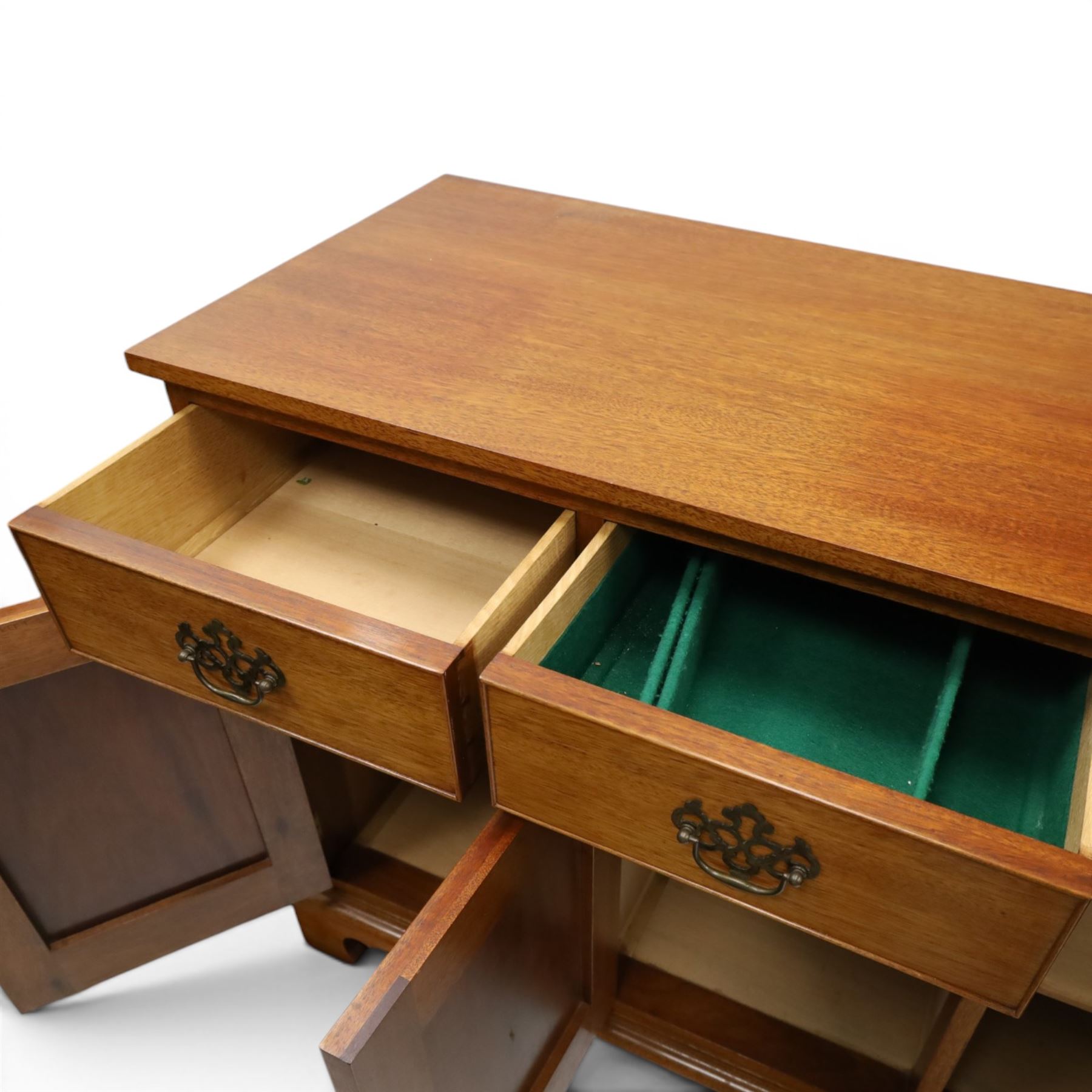 Acornman - mahogany sideboard, rectangular top over four drawers and four panelled cupboard doors with brass handles, on bracket feet, with signature carved acorn, by the workshop of Alan Grainger of Brandsby