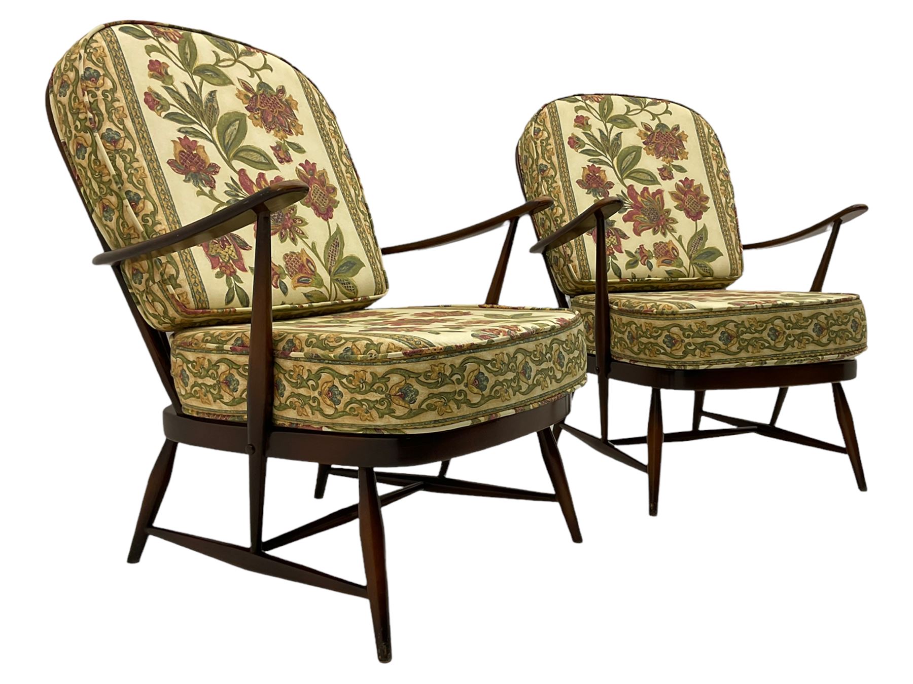 Ercol - Pair of mid-20th centur medium elm framed easy chairs, with loose patterned covers with folate design