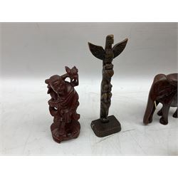Carved wooden wall hanging mask, together with carved wooden elephants, figures etc 