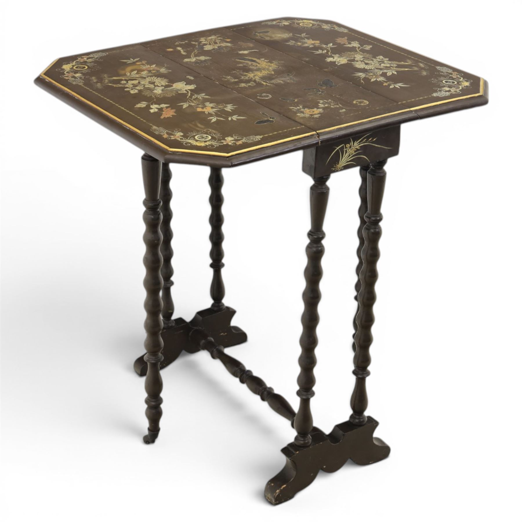 Chinoiserie style gate leg table, with gilt painted floral design, raised on bobbing supports, on sled feet