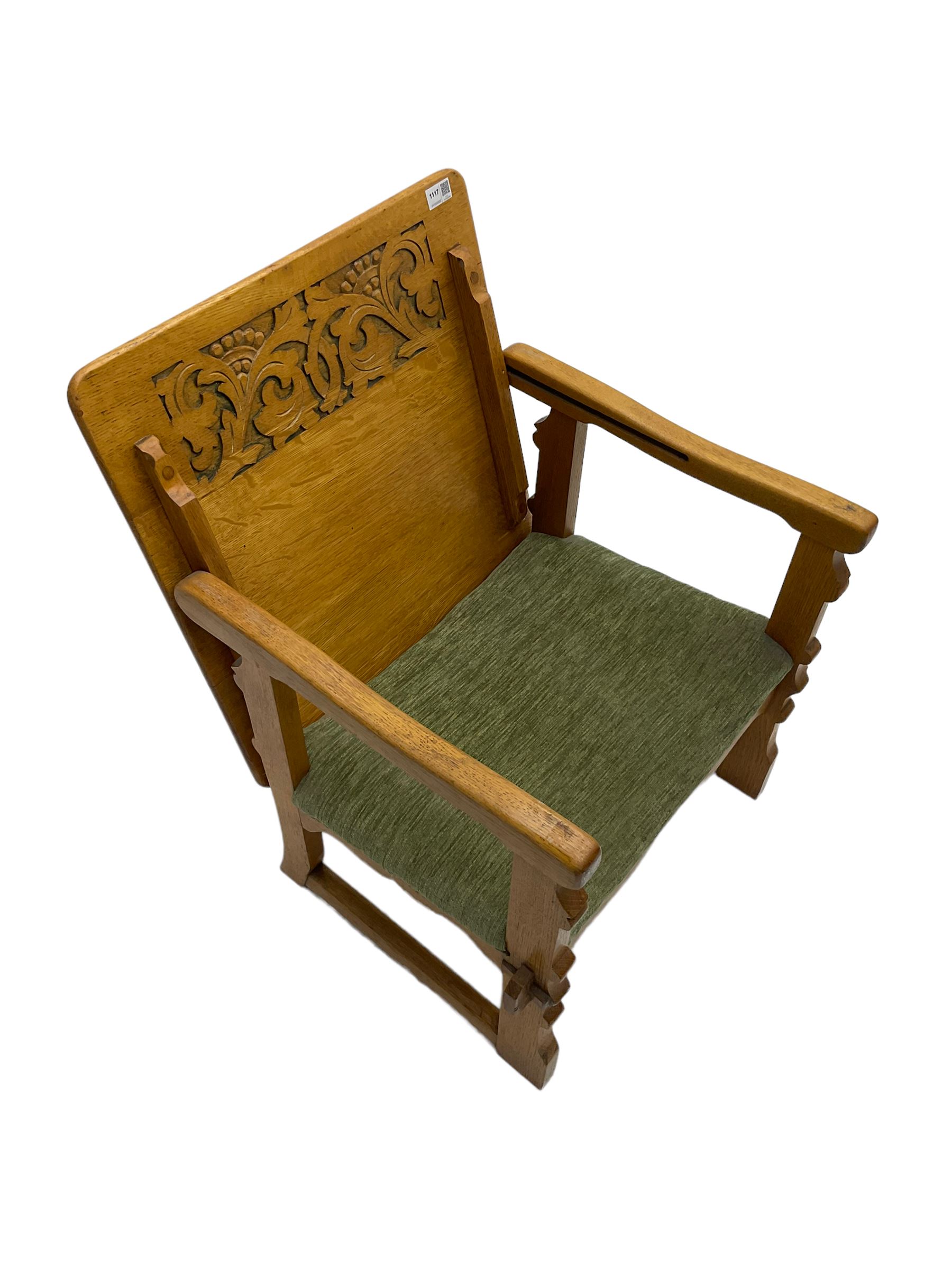 Mid20th century oak metamorphic table chair, the hinged and side back carved with scrolling