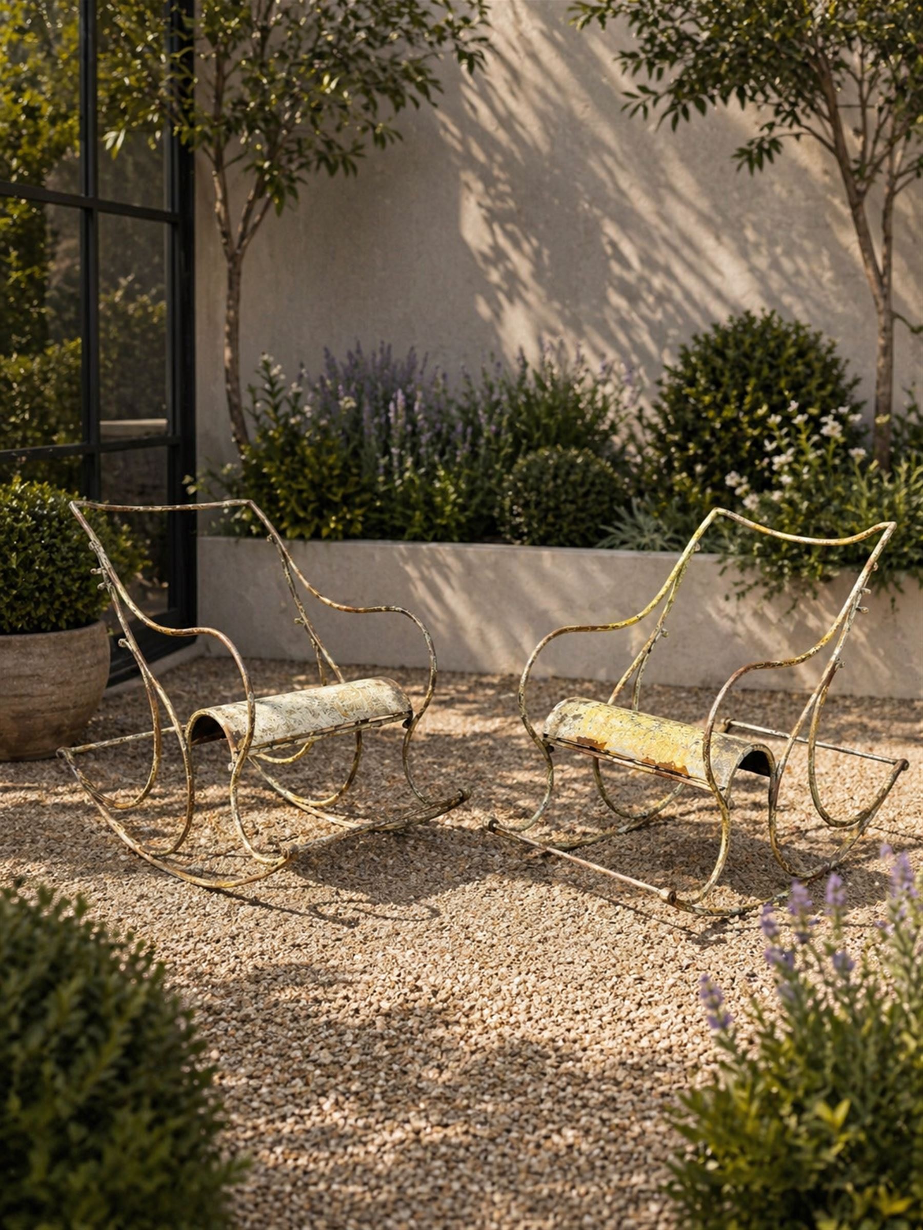 Pair of white painted cast metal garden chairs, ornate reclined backs, circular pierced seats on cabriole legs