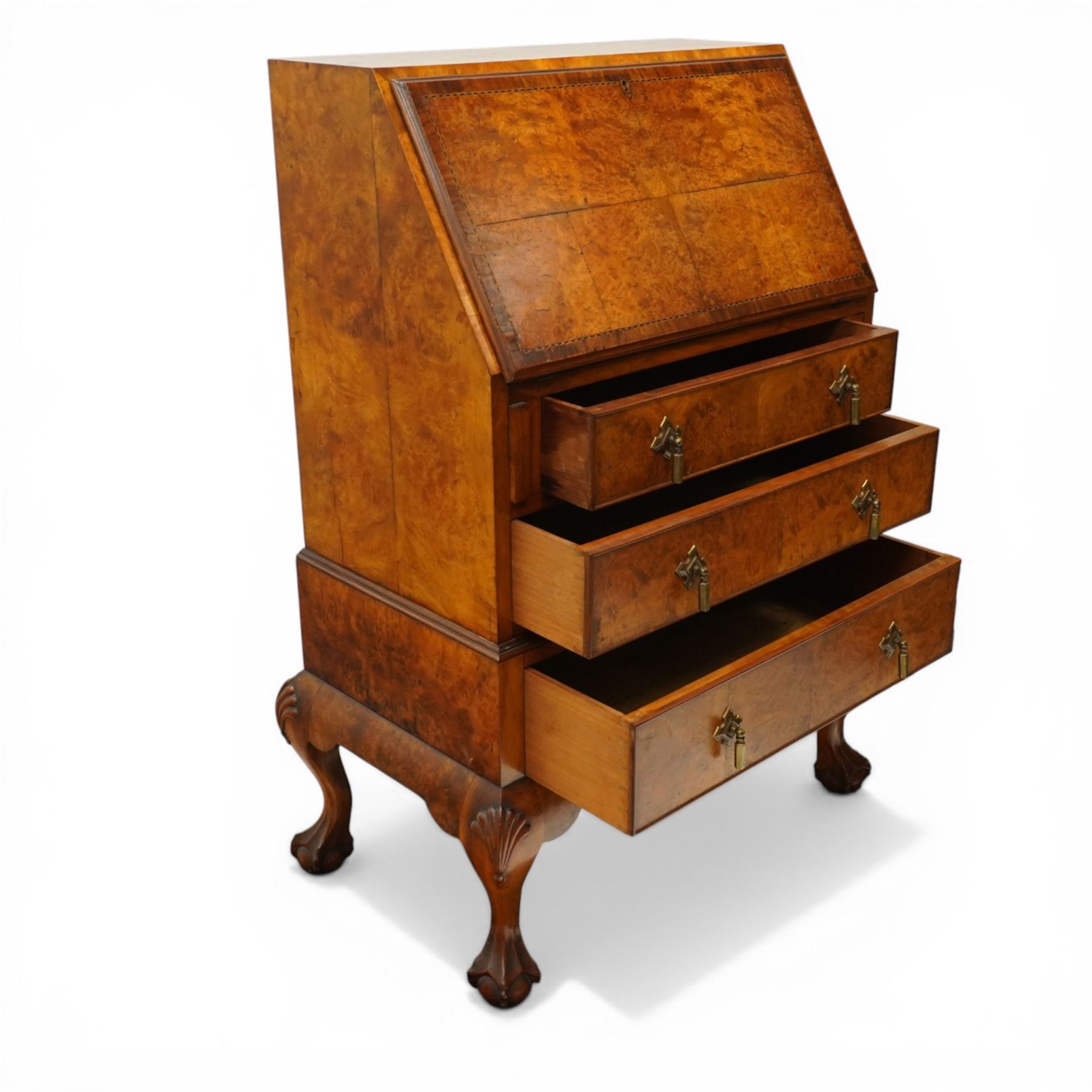 Early 20th century Queen Anne design figured walnut bureau, fall-front enclosing fitted interior, over three graduating cock-beaded drawers, shaped apron with moulded scallop shell motifs, over cabriole supports with ball-and-claw feet