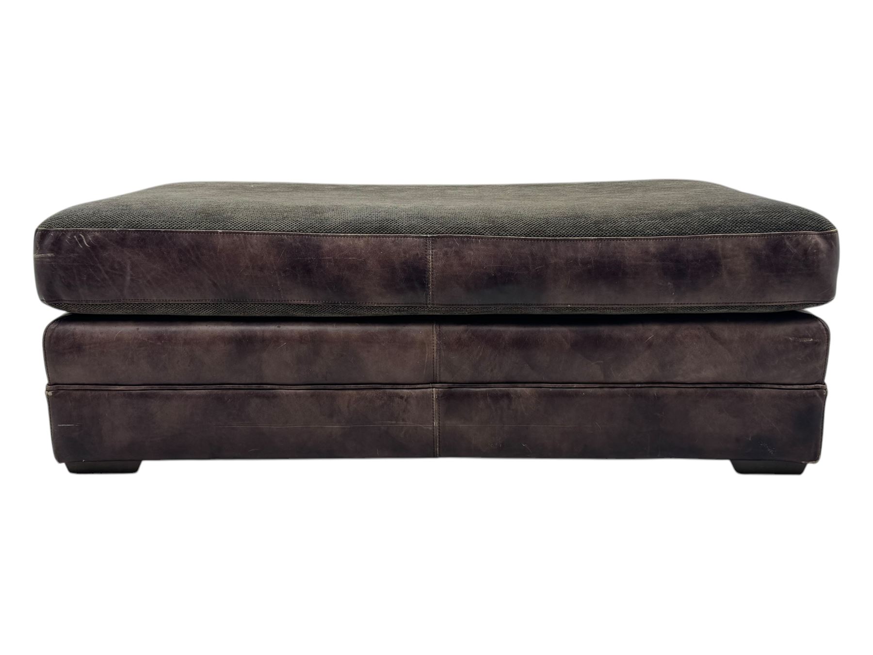 Large Knole design three-seat sofa upholstered in brown leather with scatter cushions upholstered in contrasting striped and Union Jack patterned fabric, on block feet (W210cm, H100cm, D102cm); together with matching rectangular footstool (135cm x 75cm, H45cm)