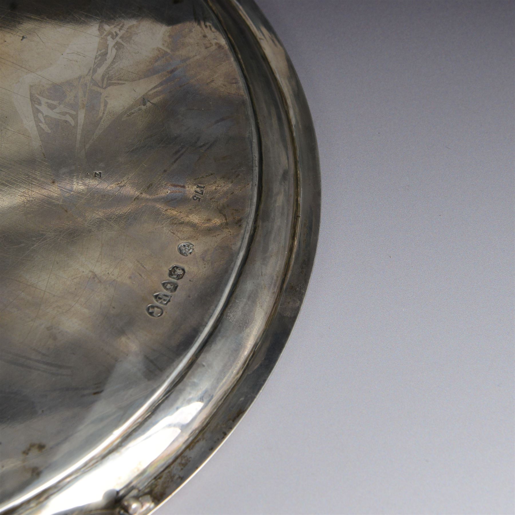 Victorian silver tray, of circular form with beaded rim, engraved to the centre with floral decoration, upon three scroll mounted paw feet, hallmarked Walter & John Barnard, London 1877, D30.5cm