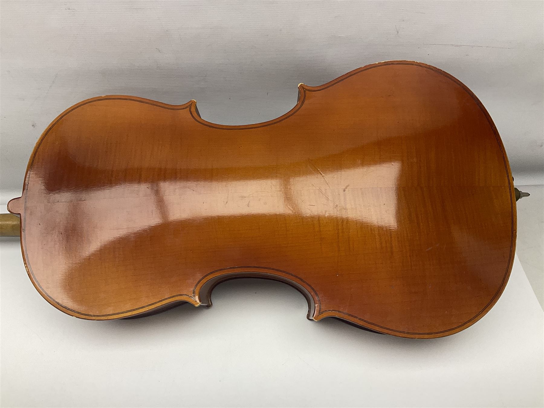 German half-size cello with 69cm two-piece maple back and ribs and spruce top; L112.5cm overall; in soft carrying case with two bows