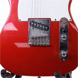 Fender Telecaster electric guitar, serial no. T021384 made in Japan c.1994, with Candy Apple Red body, white scratch plate and maple neck, guitar L98cm