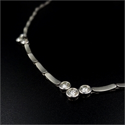  Brushed white gold necklace set with nine round brilliant cut diamonds, hallmarked 18ct  