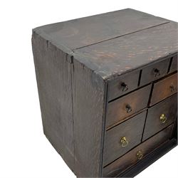 18th century oak spice cupboard, single panelled door enclosing eight drawers of various sizes, reed moulded front edges
