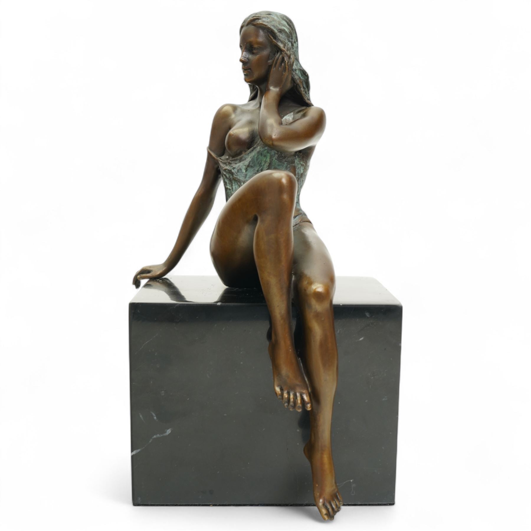 Bronze modelled as a seated lady, signed Milo, on black hardstone base, H25cm 