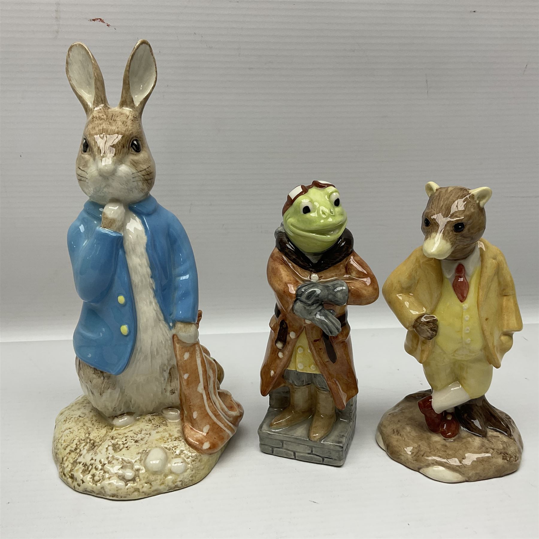 Sixteen Royal Albert Beatrix Potter figures, including Poorly Peter Rabbit, Jemima Puddle Duck and Squirrel Nutkin etc, all boxed together with a Beswick Beatrix Potter Jeremy Fisher miniature jug and four Beswick Wind in the Willows figures 