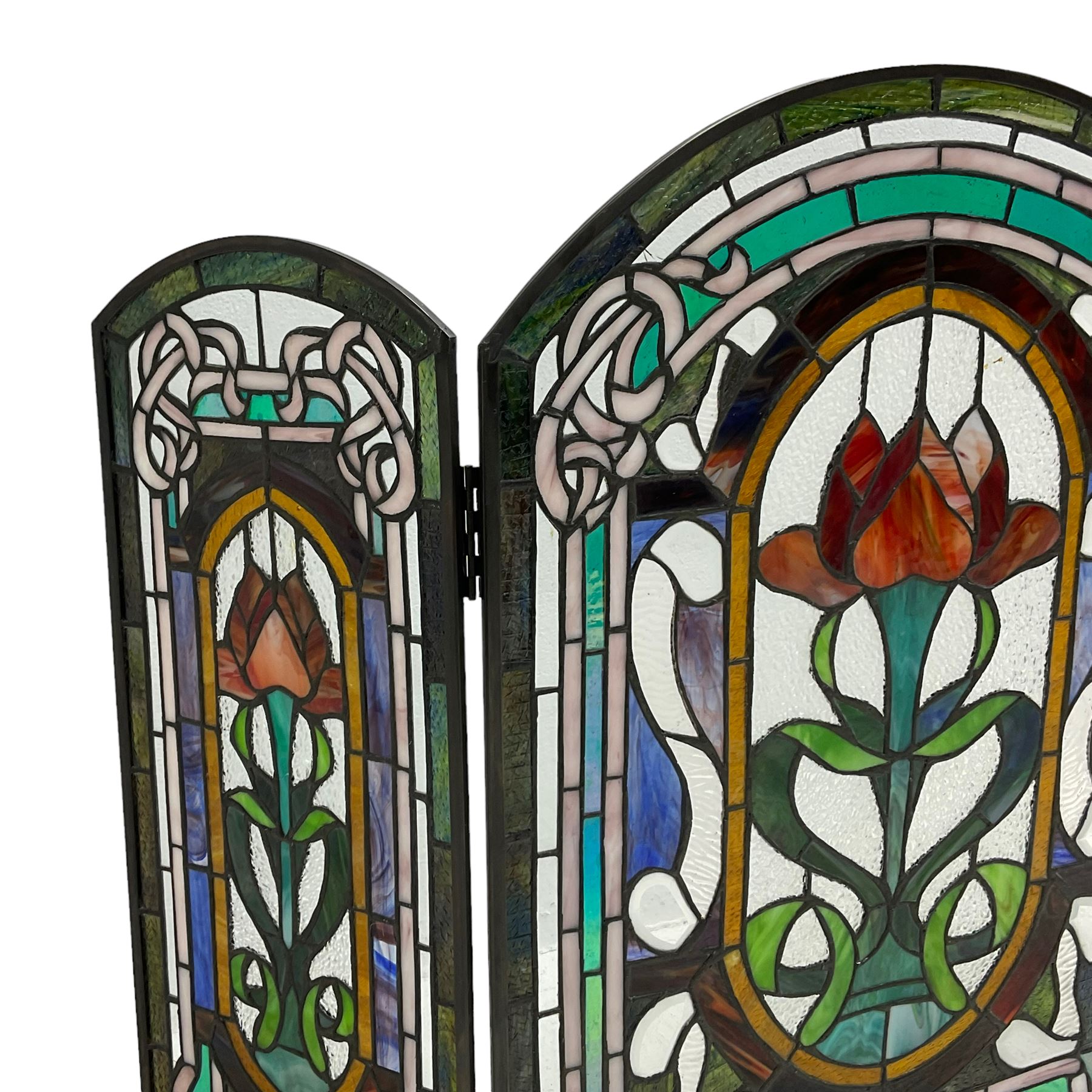 Art Nouveau design stained glass three panel fire screen, decorated with tulips and interlacing borders