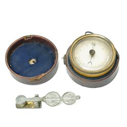 Early 20th century brass pocket barometer/ thermometer in outer leather case D8cm and a se...