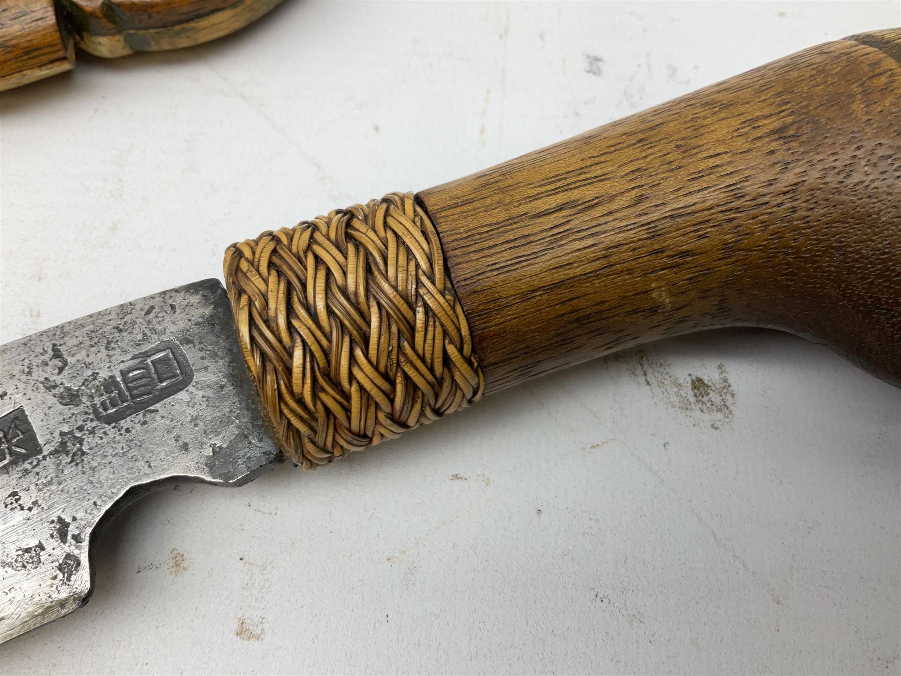 Malaysian parang survival knife the 29cm steel blade with character marks, cane bound teak grip carved with a stylised turtle head to the pommel, with matching teak scabbard L46cm overall
