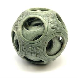 A carved Chinese soap stone puzzle ball with six concentric layers, H10.5cm. 