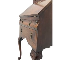 Small early 20th century Queen Anne style bookcase on bureau secretaire, the moulded arched pediment over mirrored door in shaped frame, the bureau fitted with fall front enclosing curved fitted interior, cushion moulded drawer over single drawer, on scroll and shell carved cabriole supports