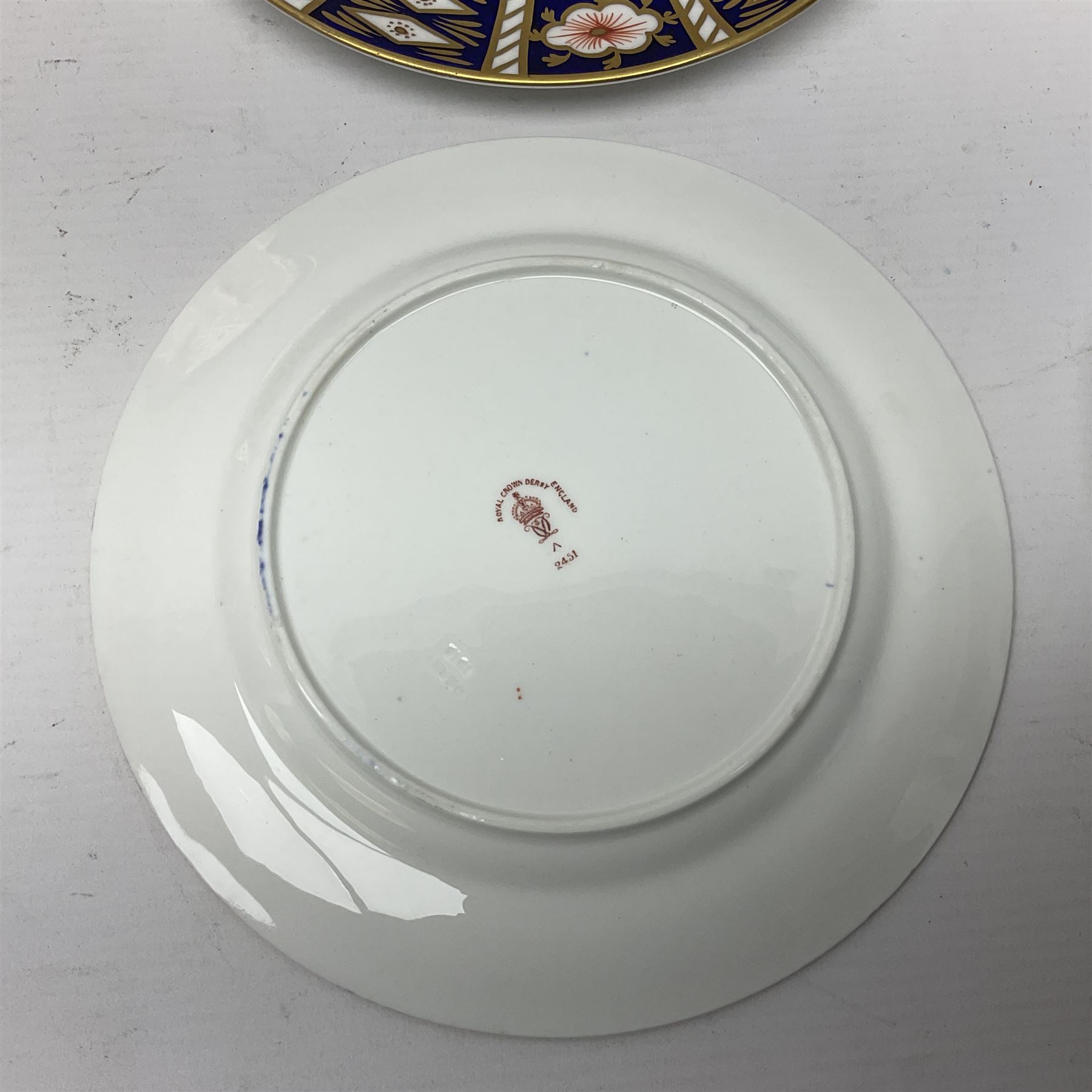 Ten Royal Crown Derby plates all in imari pattern 2451, in various sizes, comprising five D15.5cm, four D18cm and one D23cm